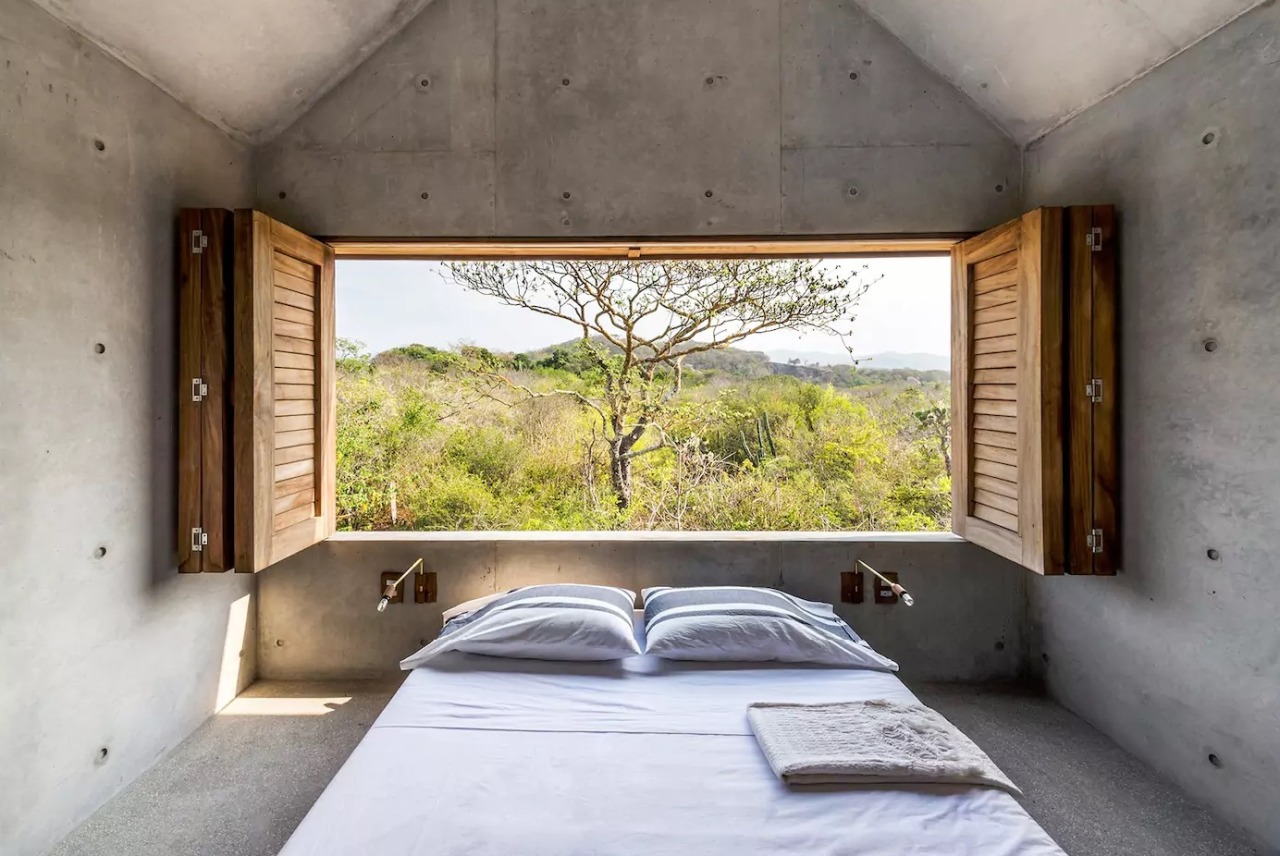 open air concrete house bedroom