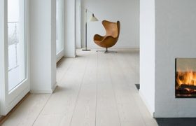 wide white oak flooring minimal interior with fireplace