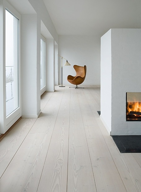 wide white oak flooring minimal interior with fireplace